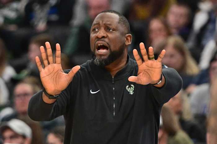 Milwaukee Bucks head coach Adrian Griffin calls a play